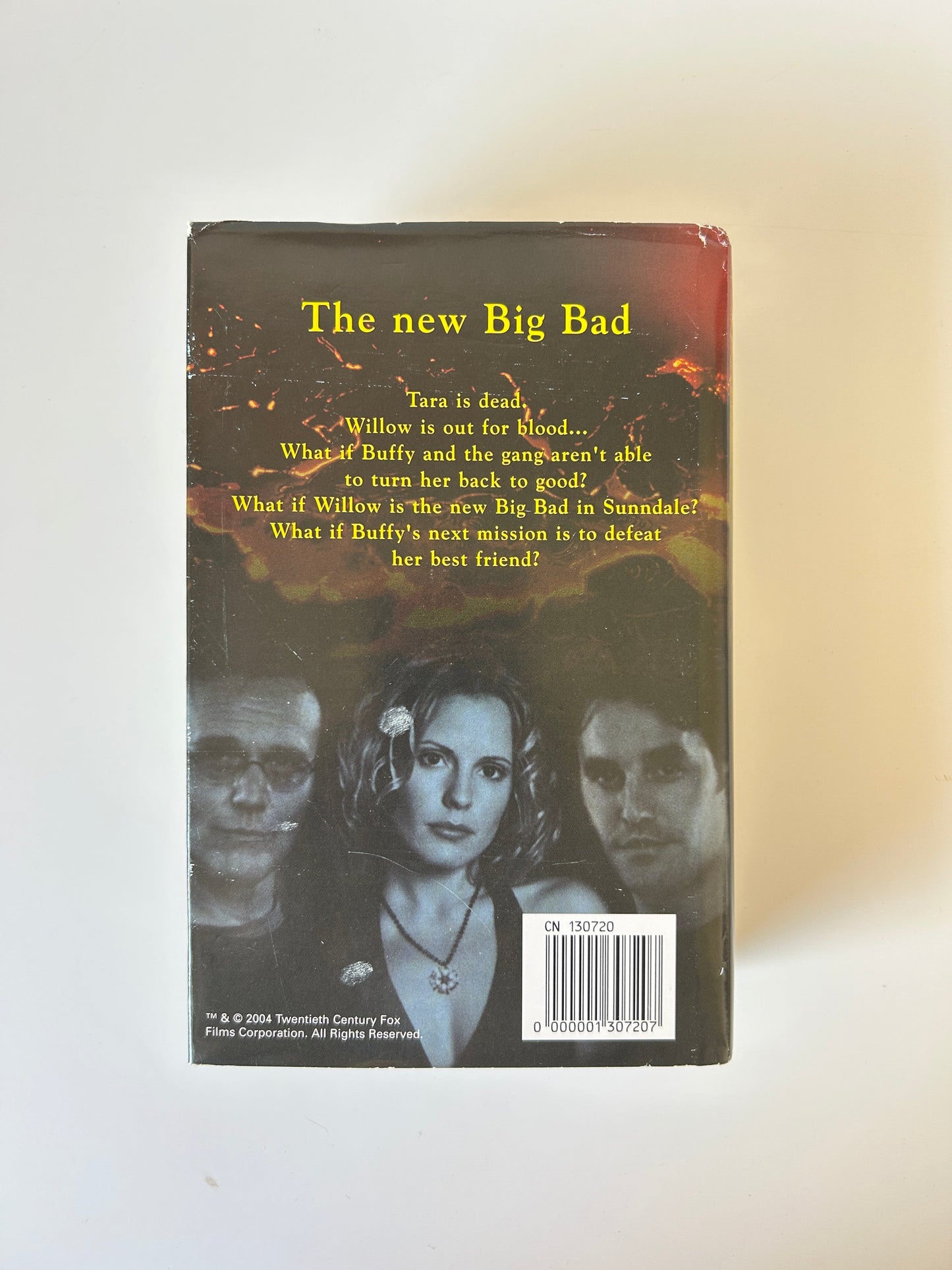 Book cover with a dark background and text, featuring a woman's face.